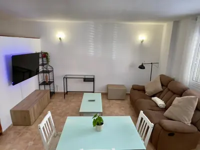 Zona de estar de FlatsBahiaArinaga En Playa de Arinaga con garaje