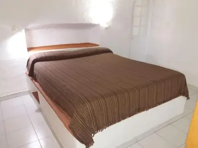 Cama o camas de una habitación en Casa cueva primera línea playa