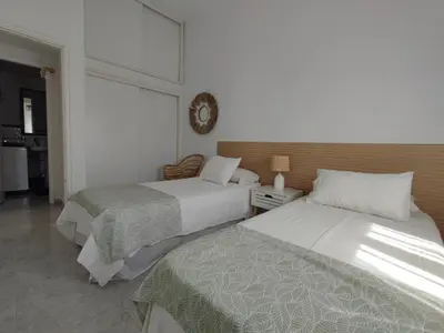 Cama o camas de una habitación en Bungalow next Yumbo Center