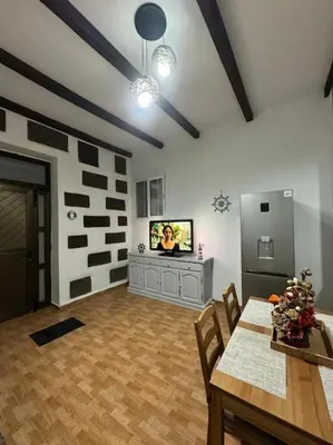 Una televisión o centro de entretenimiento en Casa Nito