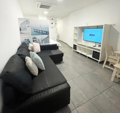 Una televisión o centro de entretenimiento en Estudio Ines Beach