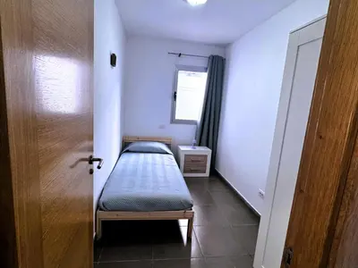 Cama o camas de una habitación en Vivelorural comfy apartment wifi & beach -Gáldar