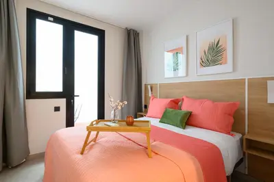 Cama o camas de una habitación en Joyful Homes
