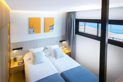 Cama o camas de una habitación en Los Canarios 527 by VillaGranCanaria