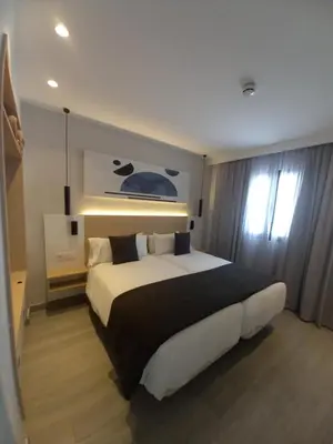 Cama o camas de una habitación en Apartamentos Marivista