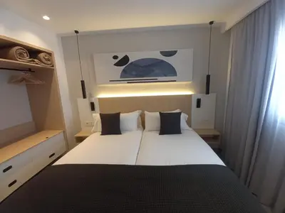 Cama o camas de una habitación en Apartamentos Marivista