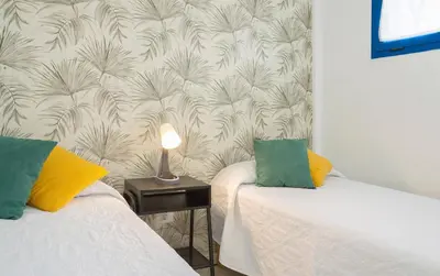 Cama o camas de una habitación en African Sunrise by Villas Rivero