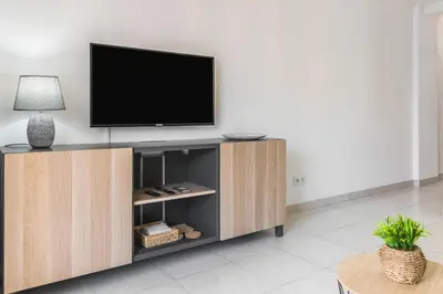 Una televisión o centro de entretenimiento en Paradise Canarian Breeze Suite