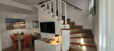 Una televisión o centro de entretenimiento en Capri Casa Infinita