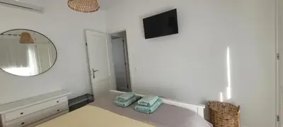 Una televisión o centro de entretenimiento en Capri Casa Infinita