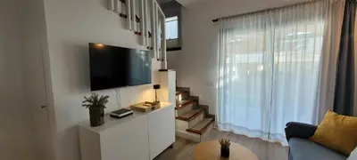 Una televisión o centro de entretenimiento en Capri Casa Infinita