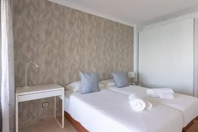 Cama o camas de una habitación en Estudio frente a la playa de Las Canteras S63