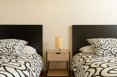 Cama o camas de una habitación en Chalé con terraza en la costa