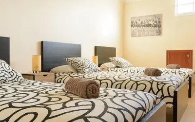 Cama o camas de una habitación en Chalé con terraza en la costa