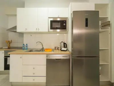 Una cocina o zona de cocina en CITY FAMILY Néstor de la Torre