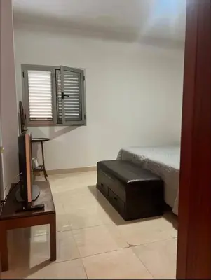 Una televisión o centro de entretenimiento en Apartamento Bonito Las Canteras