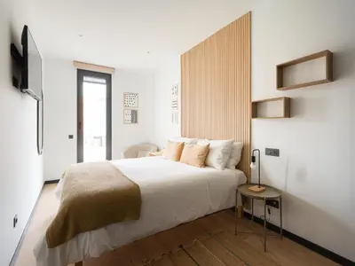 Cama o camas de una habitación en Apartamento con gimnasio cerca de la playa de Las Canteras A1B