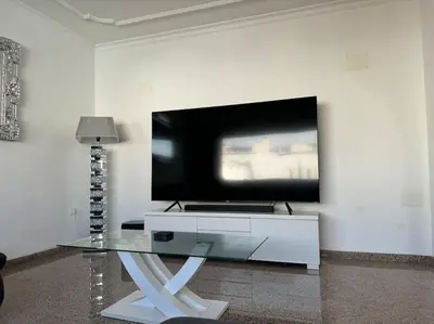 Una televisión o centro de entretenimiento en Large Villa in Maspalomas with Huge Private Pool, Jacuzzi & Gym