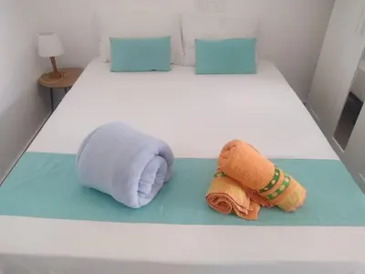 Cama o camas de una habitación en Yumbo Rainbow Homes B