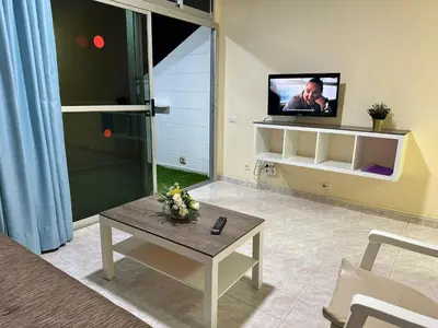 Una televisión o centro de entretenimiento en Apartamento Anau- Playa del inglés - Yumbo