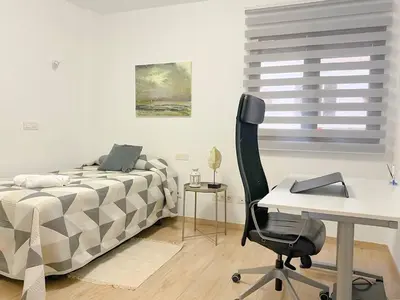Cama o camas de una habitación en Suites Esencia Atlántica: Mar, montaña y relax