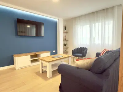 Una televisión o centro de entretenimiento en Nautilus Home Holidays