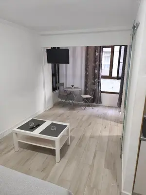 Una televisión o centro de entretenimiento en Apartamento Canteras beach