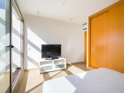 Una televisión o centro de entretenimiento en Salobre Golf Villas Golfers