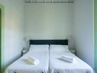 Cama o camas de una habitación en Suite Olivos