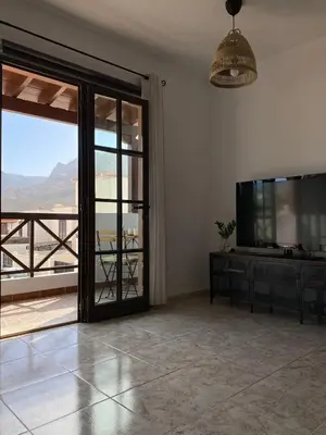 Una televisión o centro de entretenimiento en Vivienda con vistas al mar, cerca de la playa y 3 bedrooms