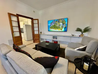 Una televisión o centro de entretenimiento en Apartamento Parque Romano