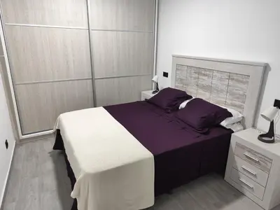 Cama o camas de una habitación en Piso cerca de la playa