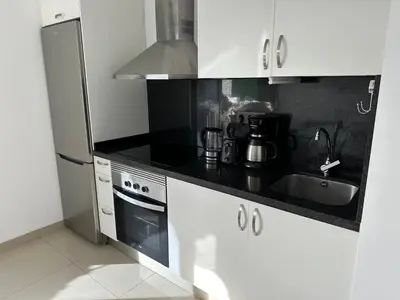 Una cocina o zona de cocina en Cozy Apartament Maspalomas
