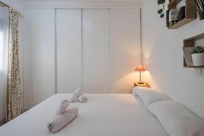 Cama o camas de una habitación en Cozy Mesa Y López House 5min To Las Canteras