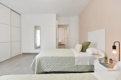Cama o camas de una habitación en El Corazon en el Puerto by VillaGranCanaria