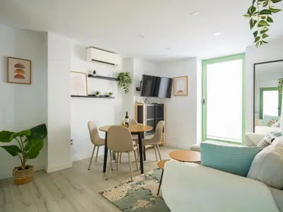 Una televisión o centro de entretenimiento en Apartamento moderno en centro historico GB2A