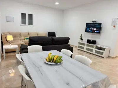 Una televisión o centro de entretenimiento en Apartamento Cerca de Maspalomas