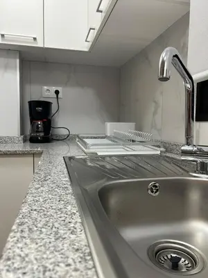 Una cocina o zona de cocina en El Faro Suite Arinaga