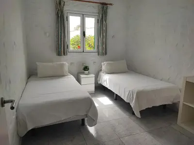 Cama o camas de una habitación en private Bungalow next to Yumbo Center
