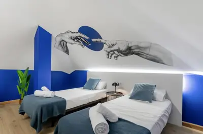 Cama o camas de una habitación en Large Attic Las Canteras Rooms - Only adults