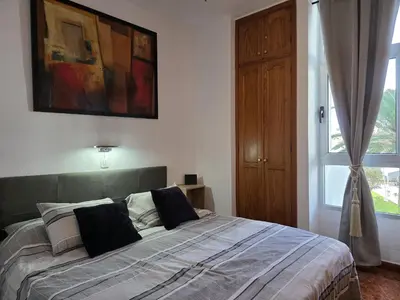 Cama o camas de una habitación en Barbados Tirajana Two Bedroom Apartment