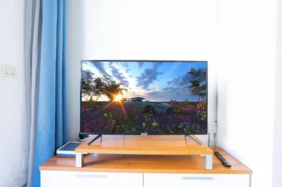 Una televisión o centro de entretenimiento en Dunaflor Verde 1213