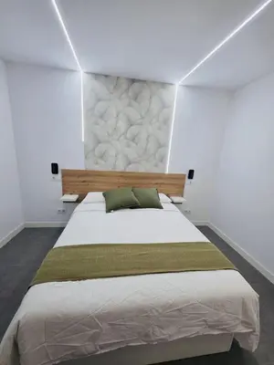 Cama o camas de una habitación en El balcón de San Nicolás