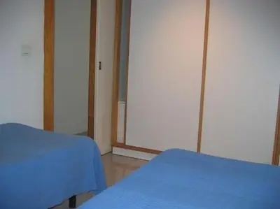 Cama o camas de una habitación en Vacacional Playa Las Canteras