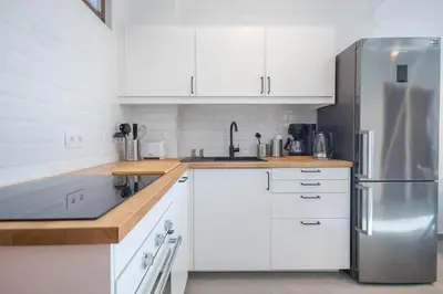 Una cocina o zona de cocina en GuestReady - Tenesor 306