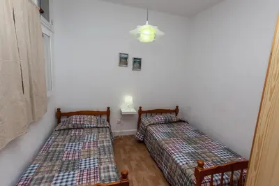 Cama o camas de una habitación en Pozo Izquierdo Apartamento Las Gaviotas