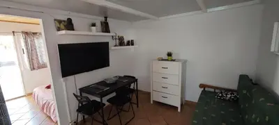 Una televisión o centro de entretenimiento en Apartamentos en Castillo del Romeral