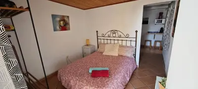 Cama o camas de una habitación en Apartamentos en Castillo del Romeral