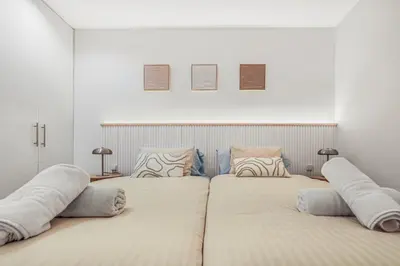 Cama o camas de una habitación en Skyline Beachfront Retreat