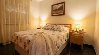 Cama o camas de una habitación en Apartamento en Vecindario con WiFi rápido